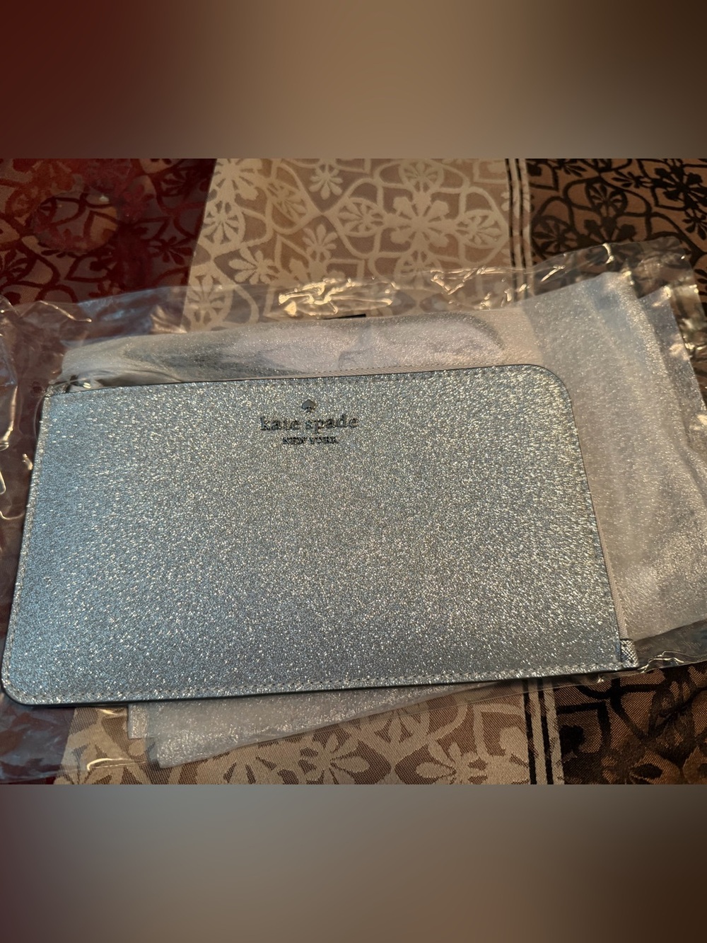 kate spade New York Silver Glitter Wristlet